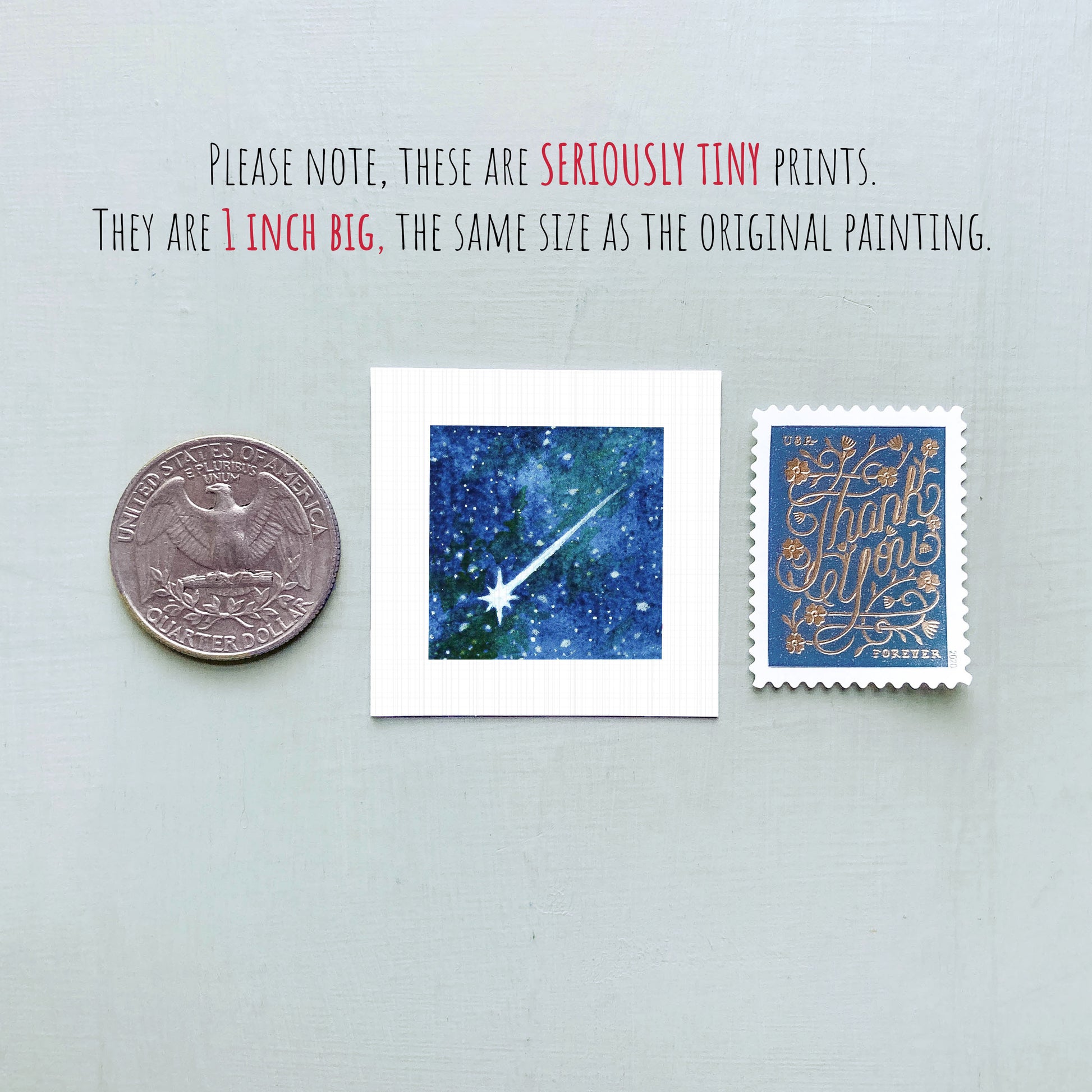 three small prints: a quarter, a square print with a blue background depicting a starry night sky, and a postage stamp with gold lettering.