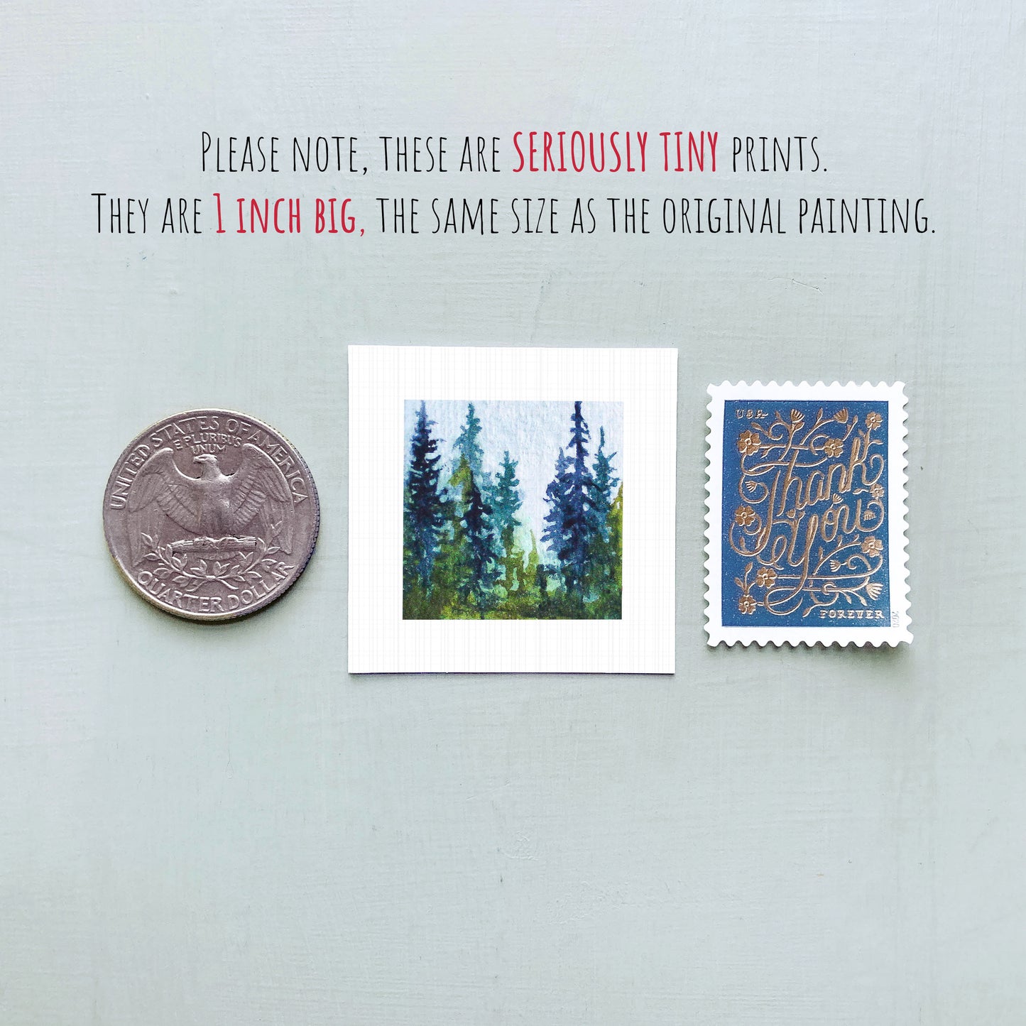 three small prints: a quarter, a square print of a painting of trees, and a postage stamp.