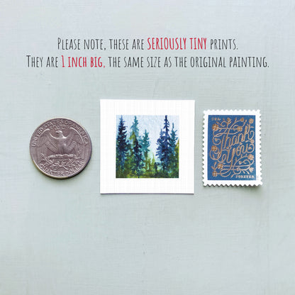 three small prints: a quarter, a square print of a painting of trees, and a postage stamp.