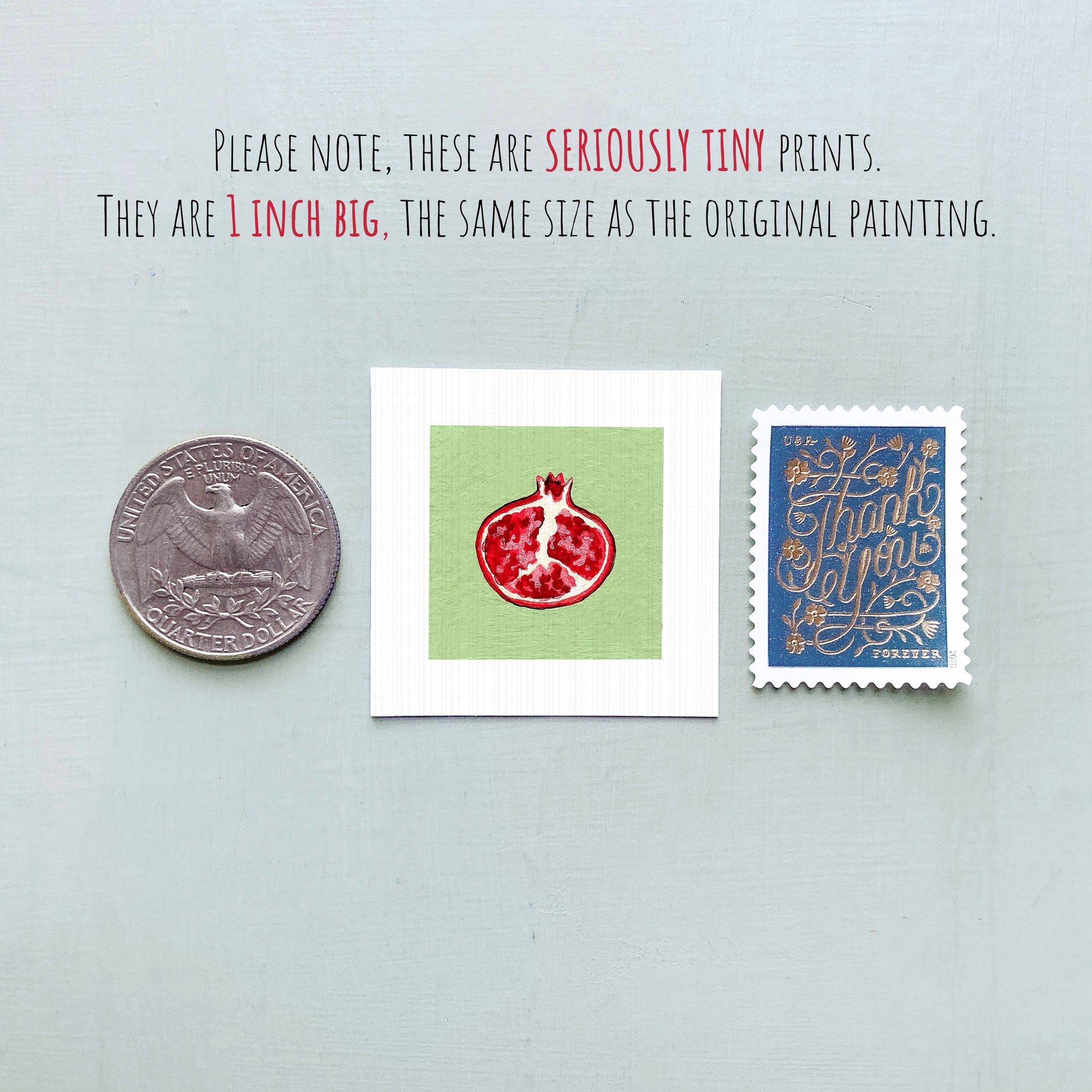 three small, seriously tiny prints: a United States quarter, a square print with a red pomegranate design, and a blue postage stamp with gold lettering.