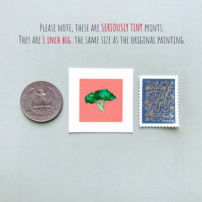 a collection of three small items: a quarter, a square with a green tree on it, and a postage stamp.