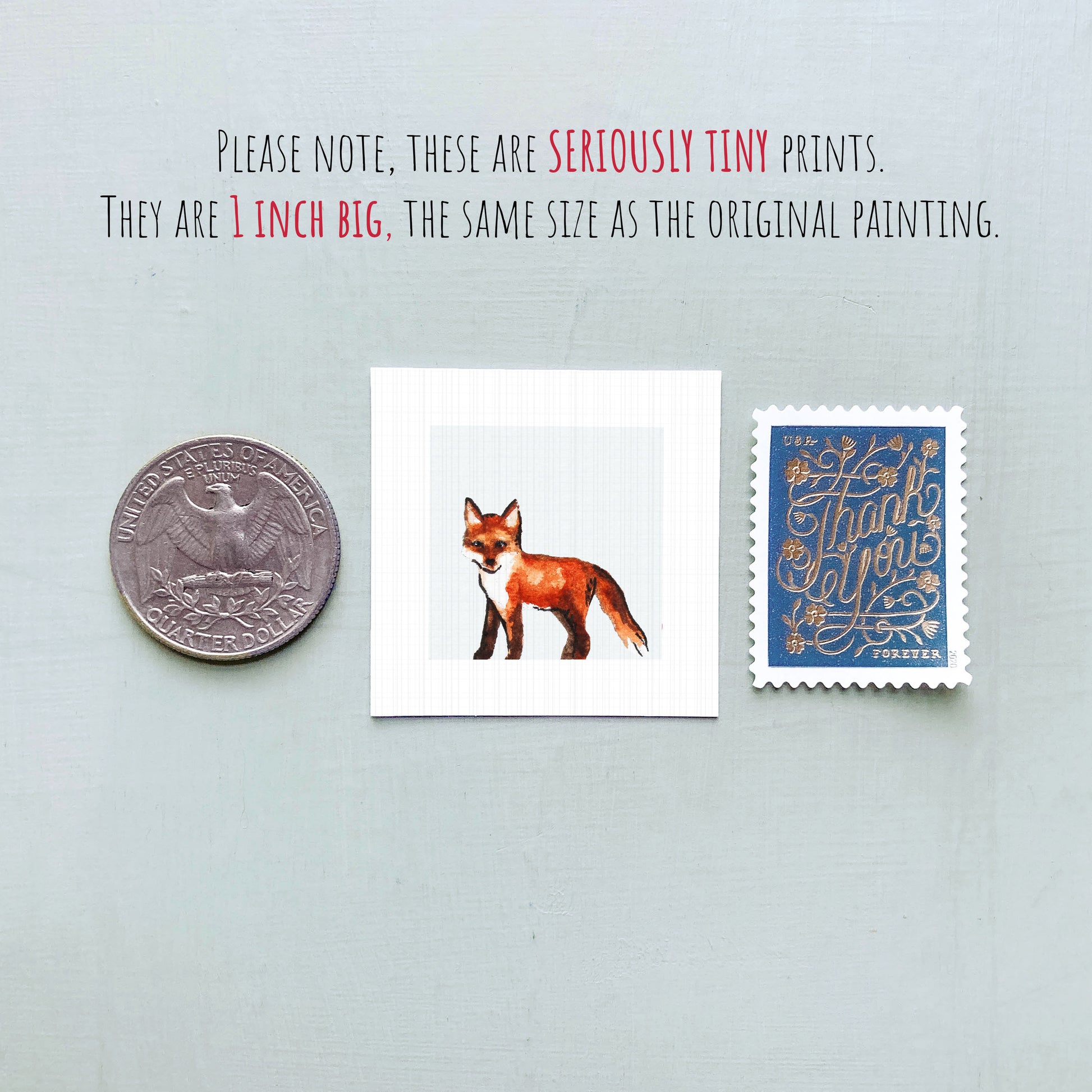 a collection of three small items: a quarter, a stamp, and a painting of a fox.