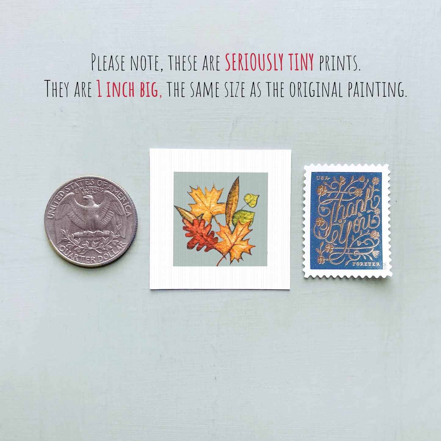 three small prints: a quarter, a square print with autumn leaves, and a postage stamp.