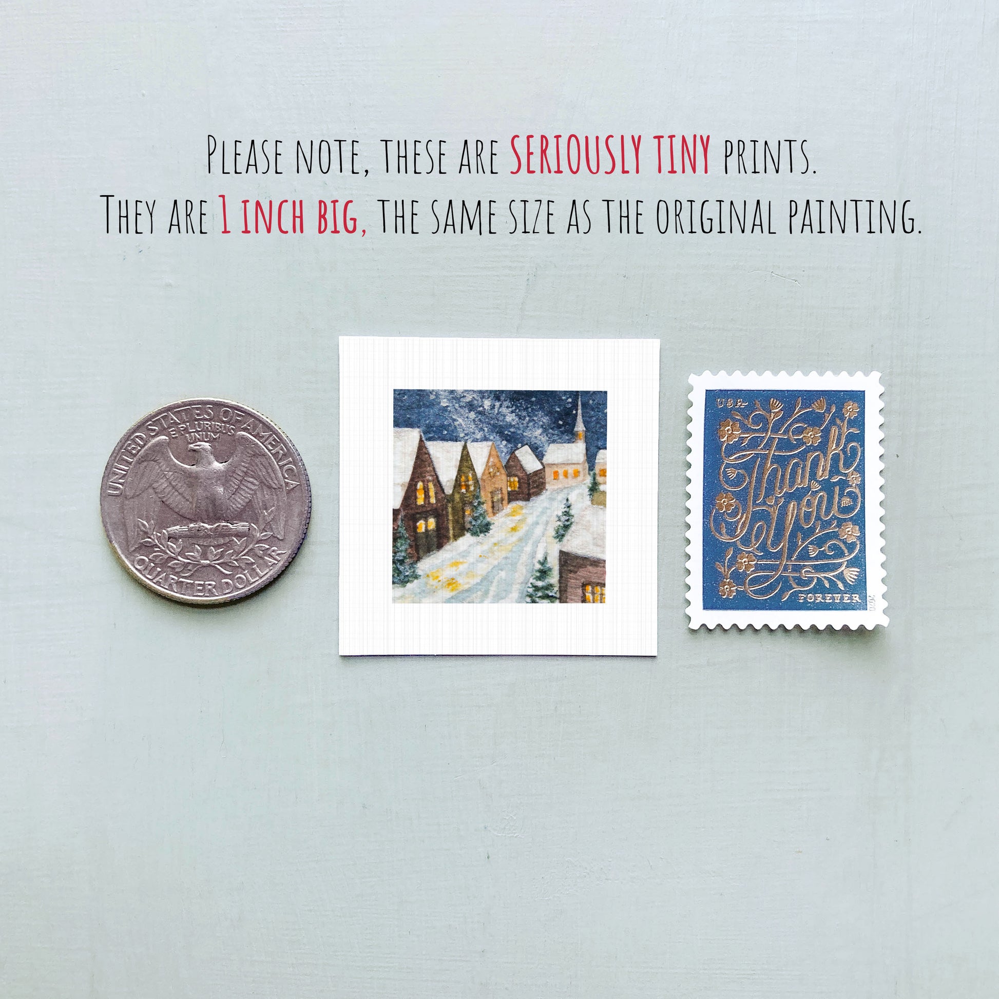three small prints: a United States quarter, a miniature painting of a snowy village, and a postage stamp.