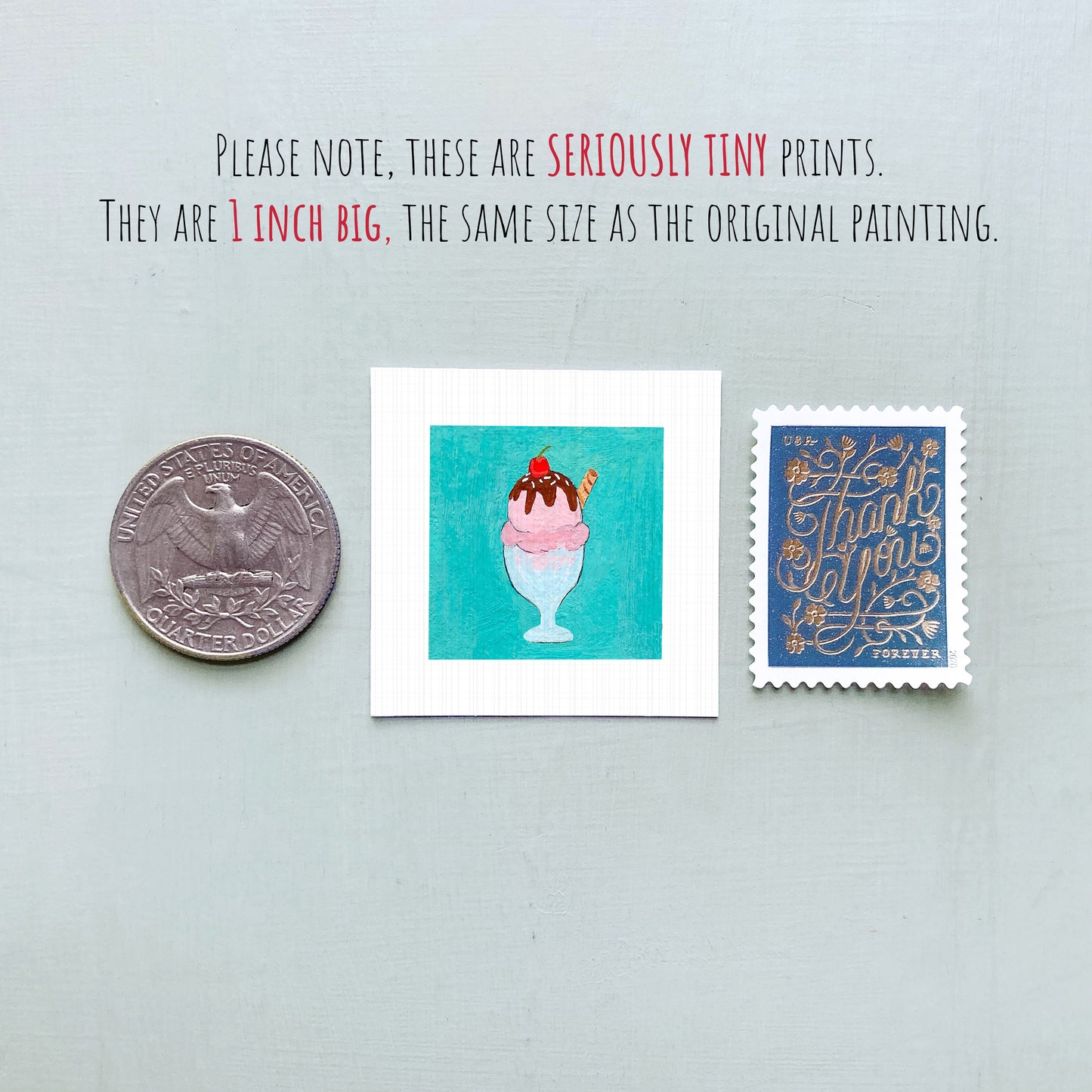 three small items: a quarter, a square with an illustration of a pink ice cream cone, and a blue postage stamp.