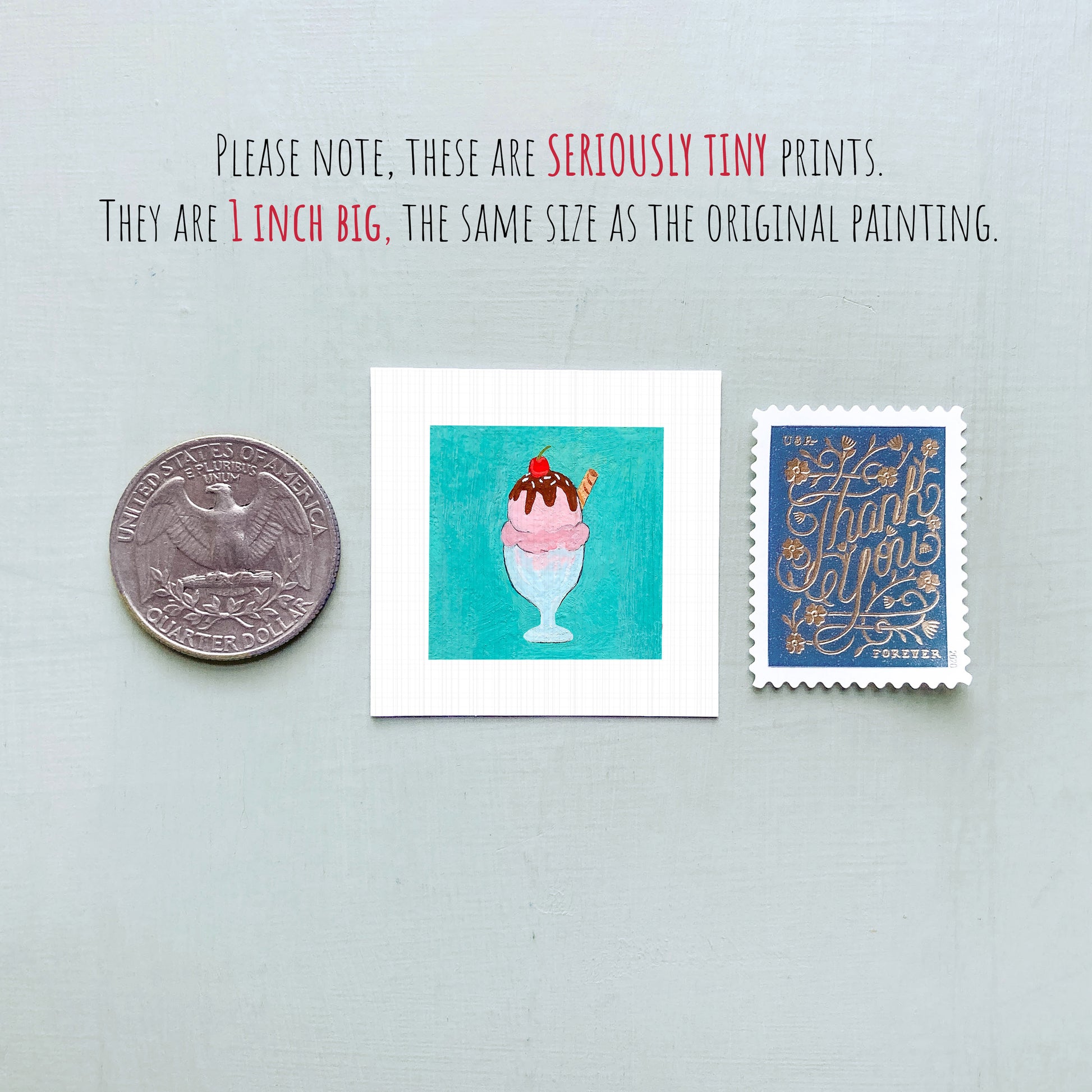three small items: a quarter, a square with an illustration of a pink ice cream cone, and a blue postage stamp.