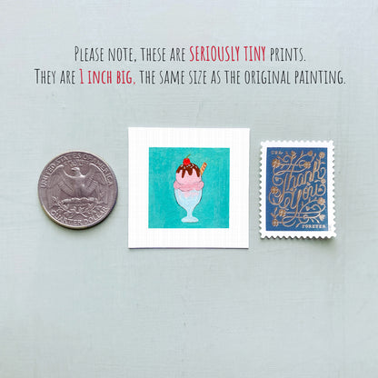 three small items: a quarter, a square with an illustration of a pink ice cream cone, and a blue postage stamp.