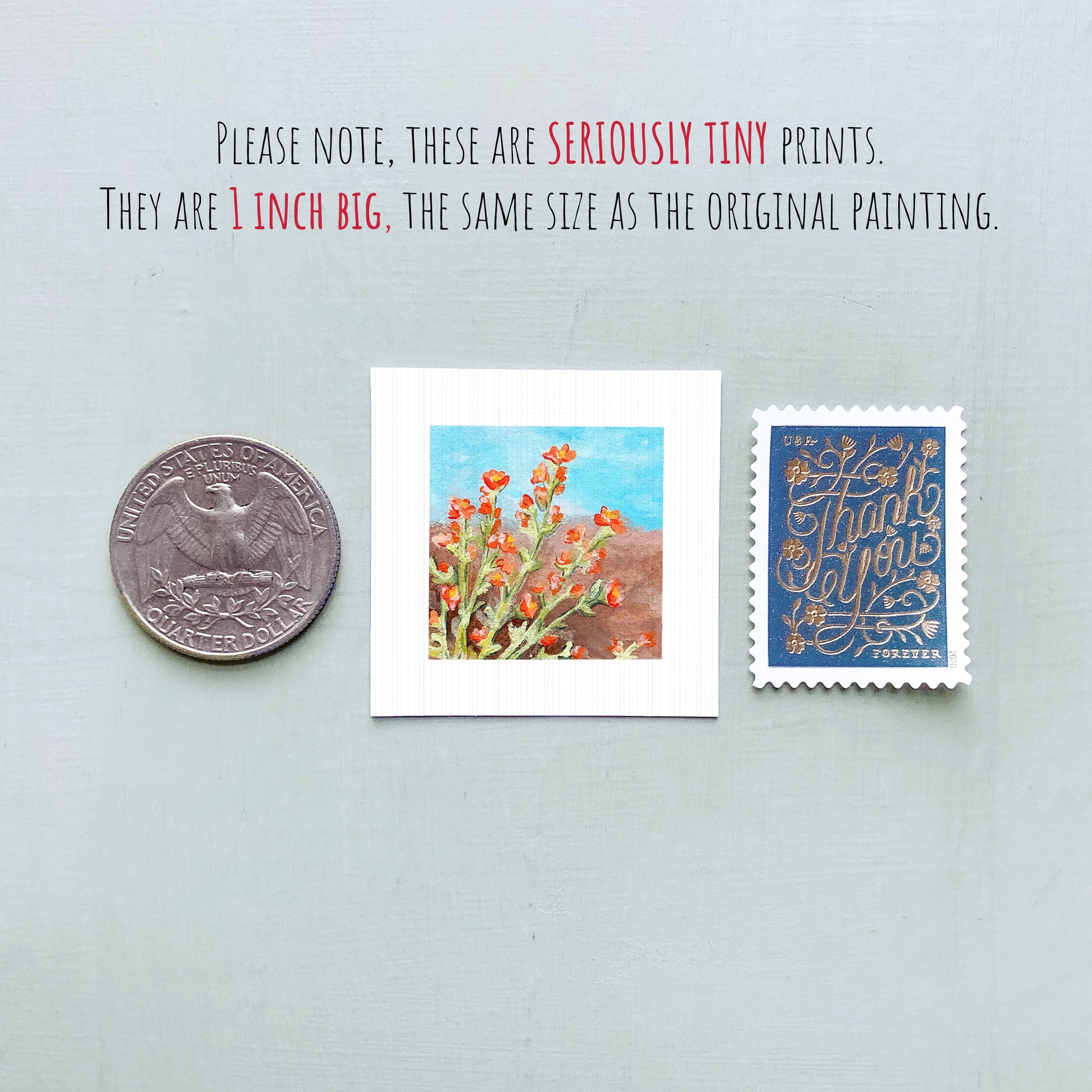 three small prints: a silver coin, a white square print of a painting of flowers, and a blue postage stamp with gold lettering.