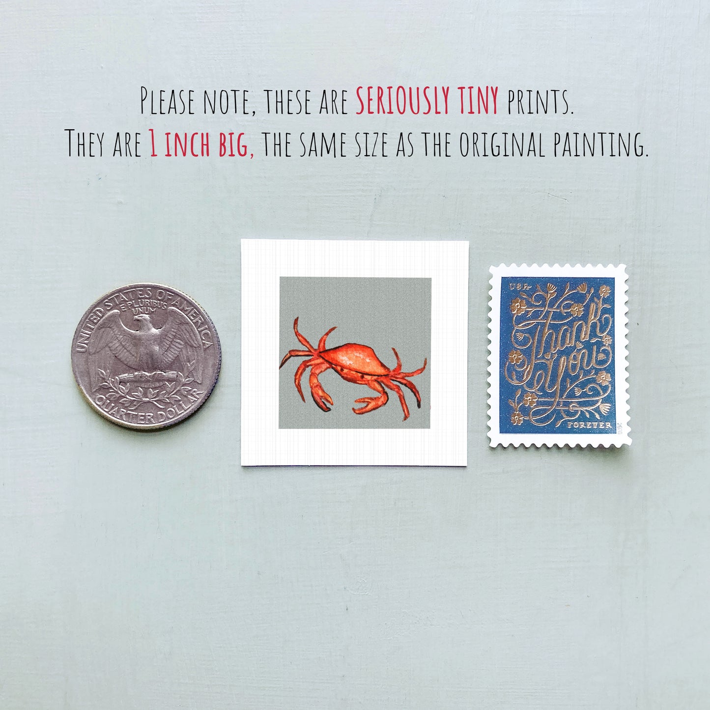three small items: a quarter, a stamp, and a painting of a crab.
