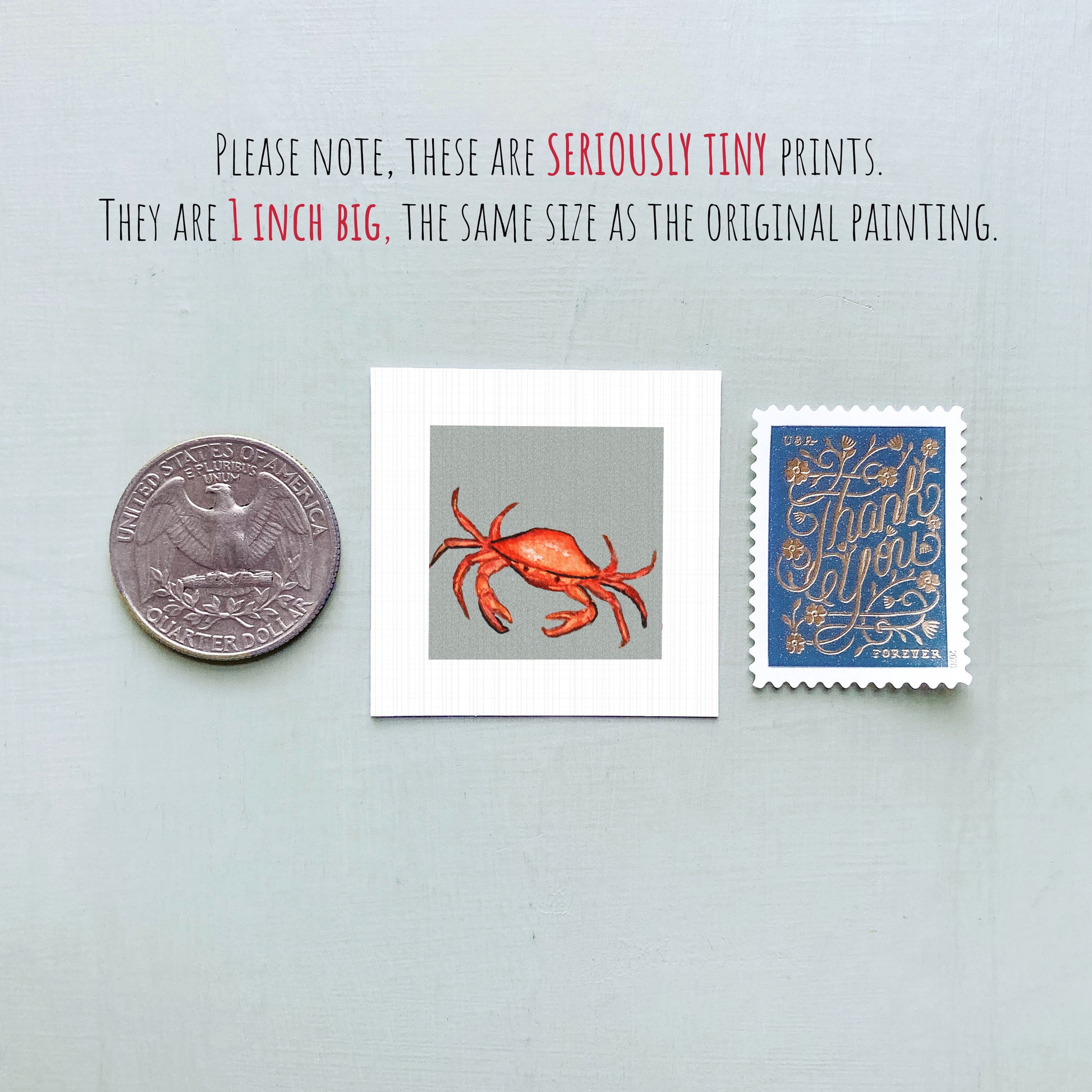 three small items: a quarter, a stamp, and a painting of a crab.