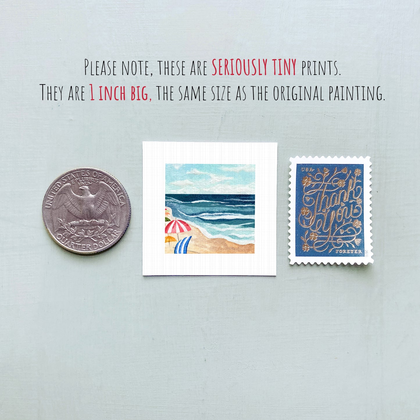 three small artworks: a coin, a postage stamp, and a painting of a beach scene.