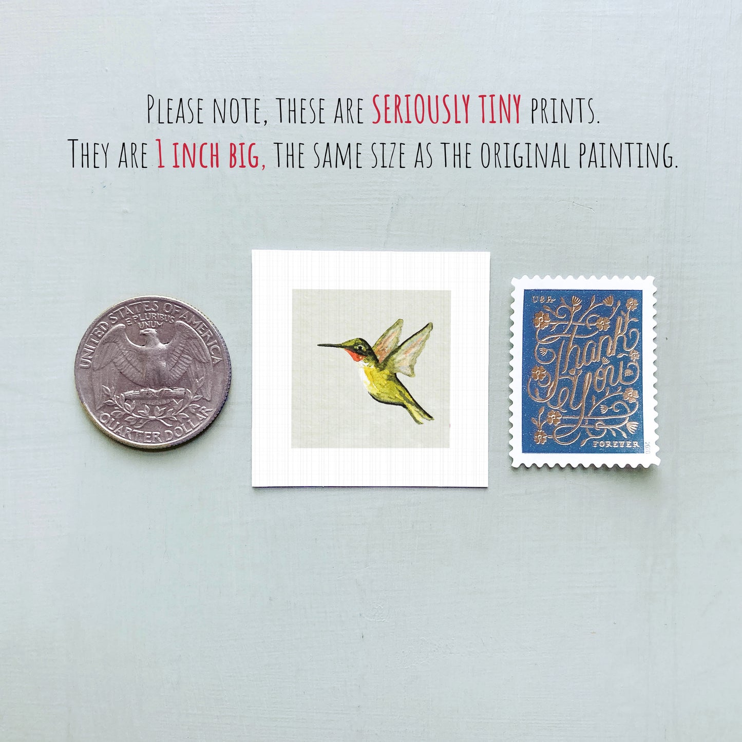 a collection of three small items: a quarter, a square print of a hummingbird, and a postage stamp.