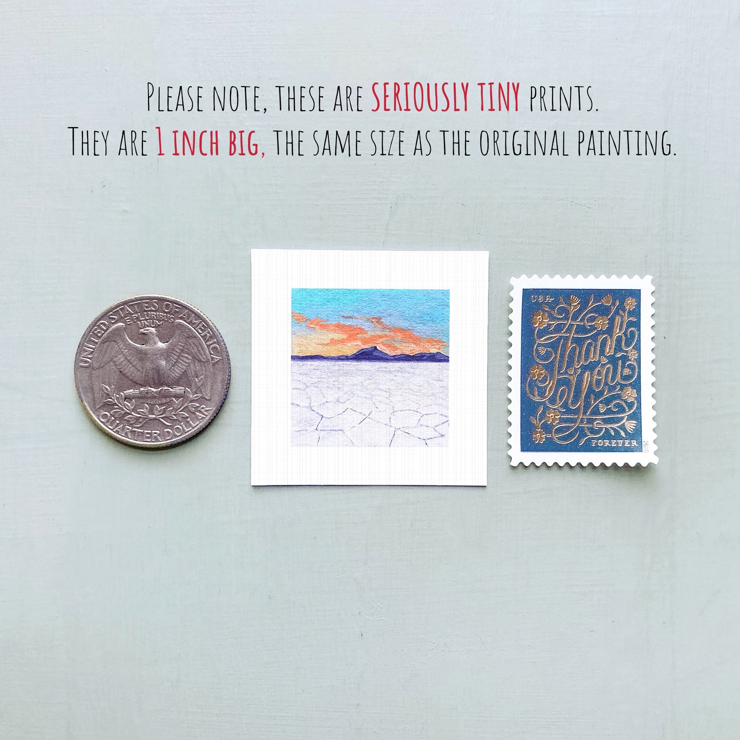 three small artworks or prints, including a coin, a postage stamp, and a painting, all of which are described as "seriously tiny prints" and "1 inch big" in the provided text.