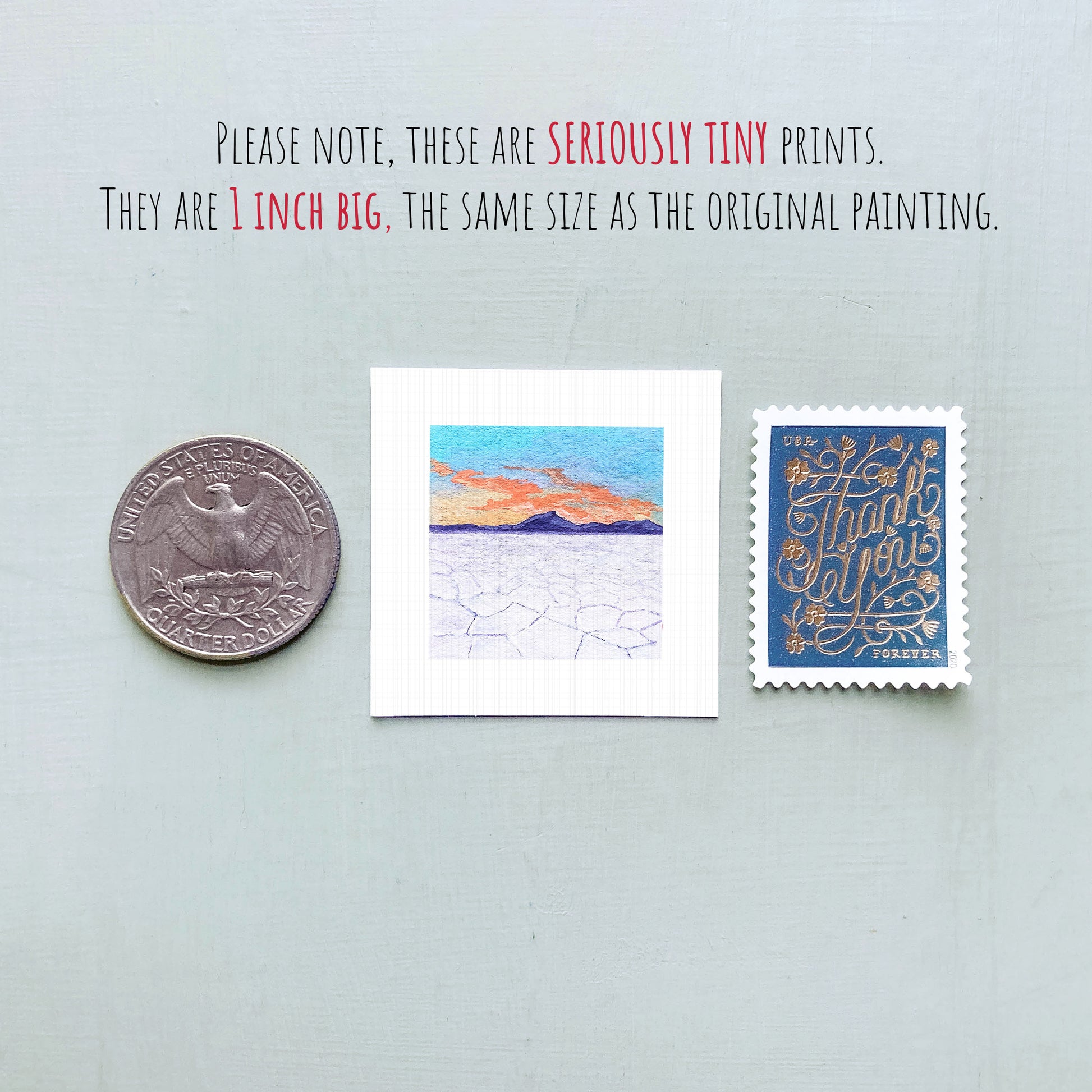 three small artworks or prints, including a coin, a postage stamp, and a painting, all of which are described as "seriously tiny prints" and "1 inch big" in the provided text.