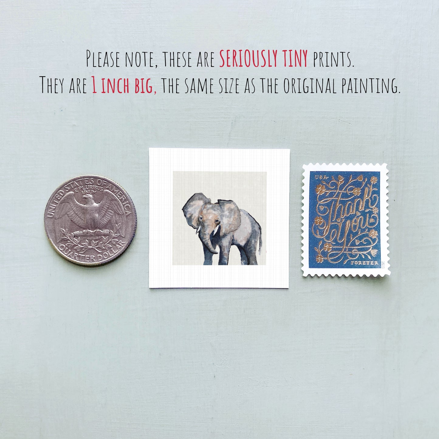 a collection of three objects: a quarter, a small painting of two elephants, and a postage stamp.