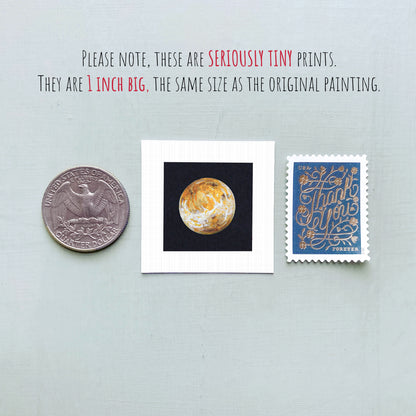 three small prints: a quarter, a square print of a planet, and a postage stamp.