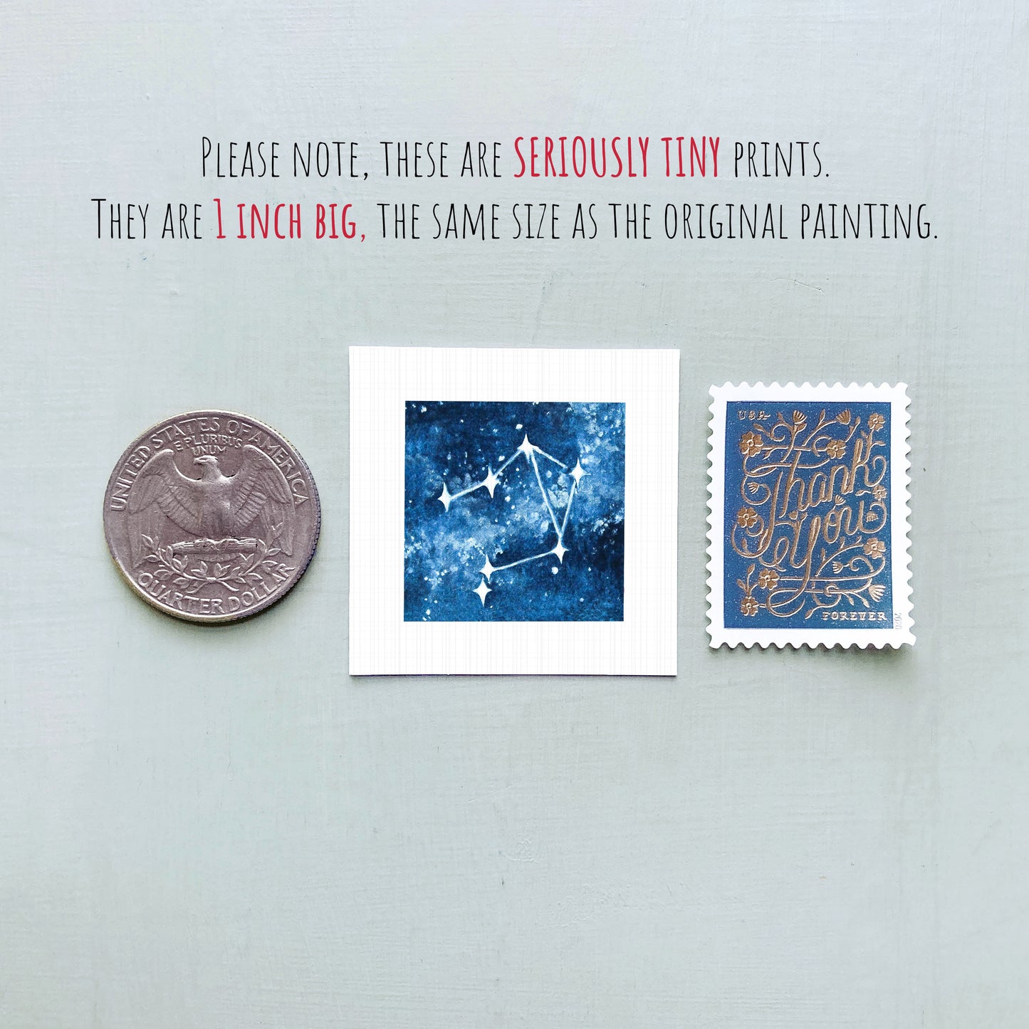 three small prints: a quarter, a square print with a blue background depicting a starry night sky, and a postage stamp.