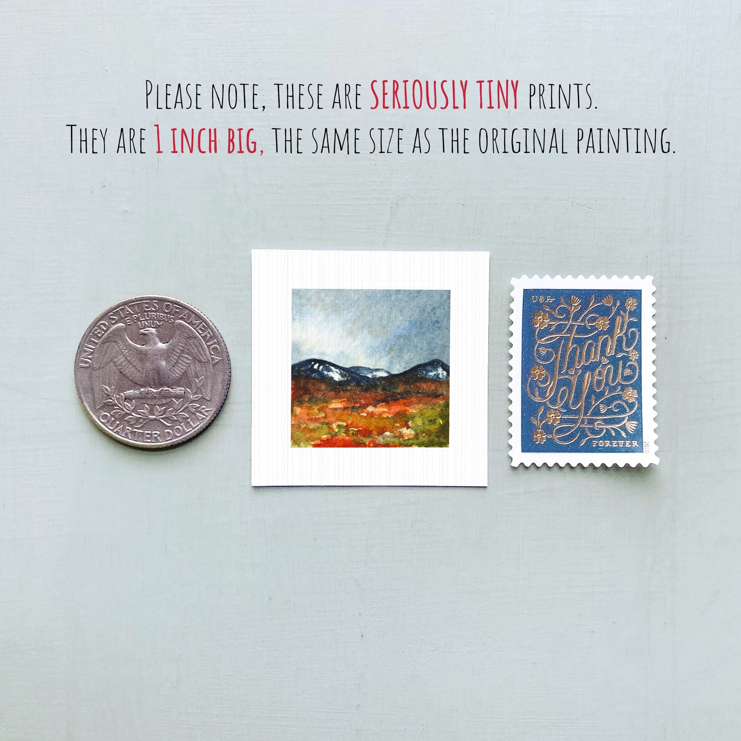 three small art prints and a United States quarter coin, all of which are described as "seriously tiny prints" and "1 inch big" in the provided text.