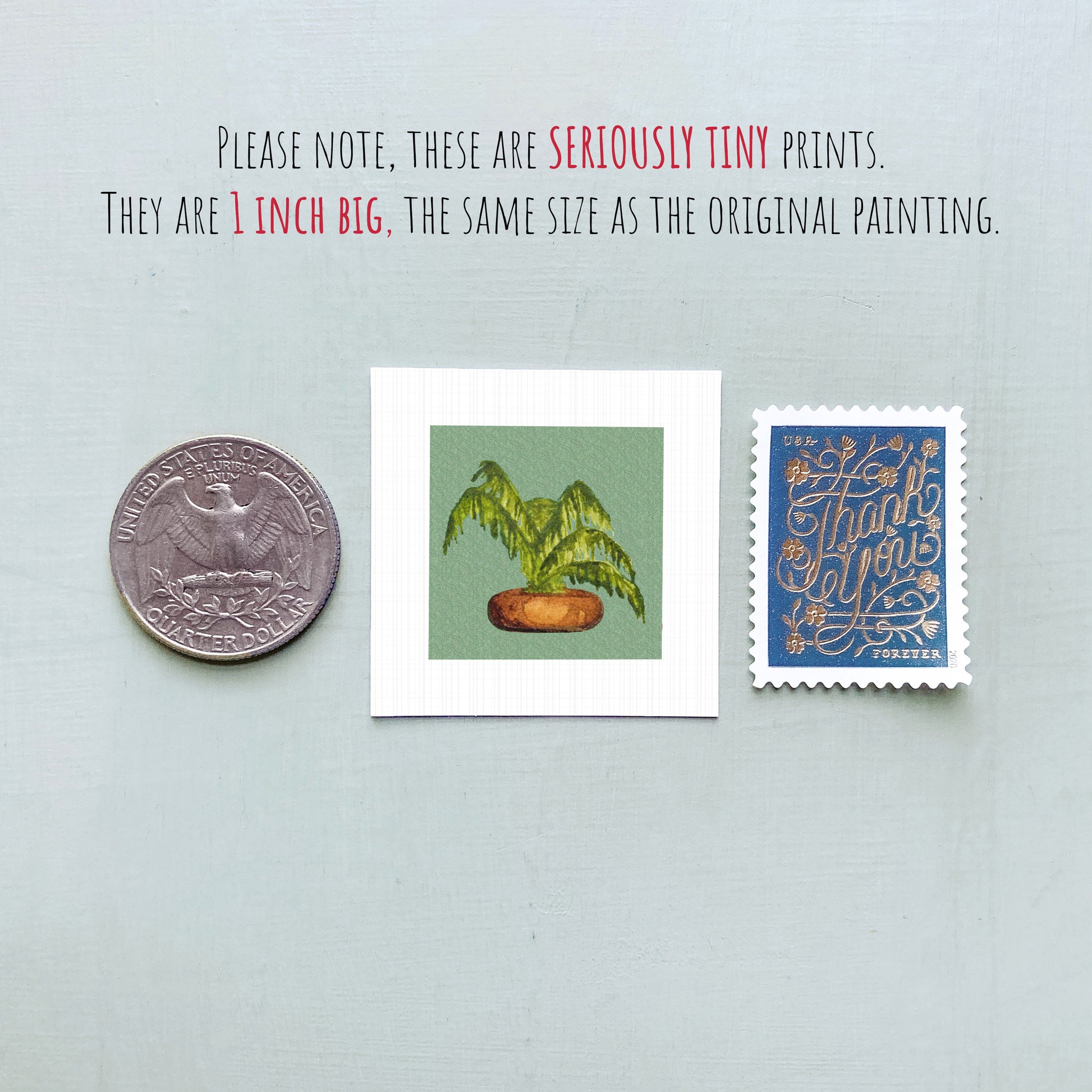 three small prints: a quarter, a square print of a plant, and a blue postage stamp with gold lettering.