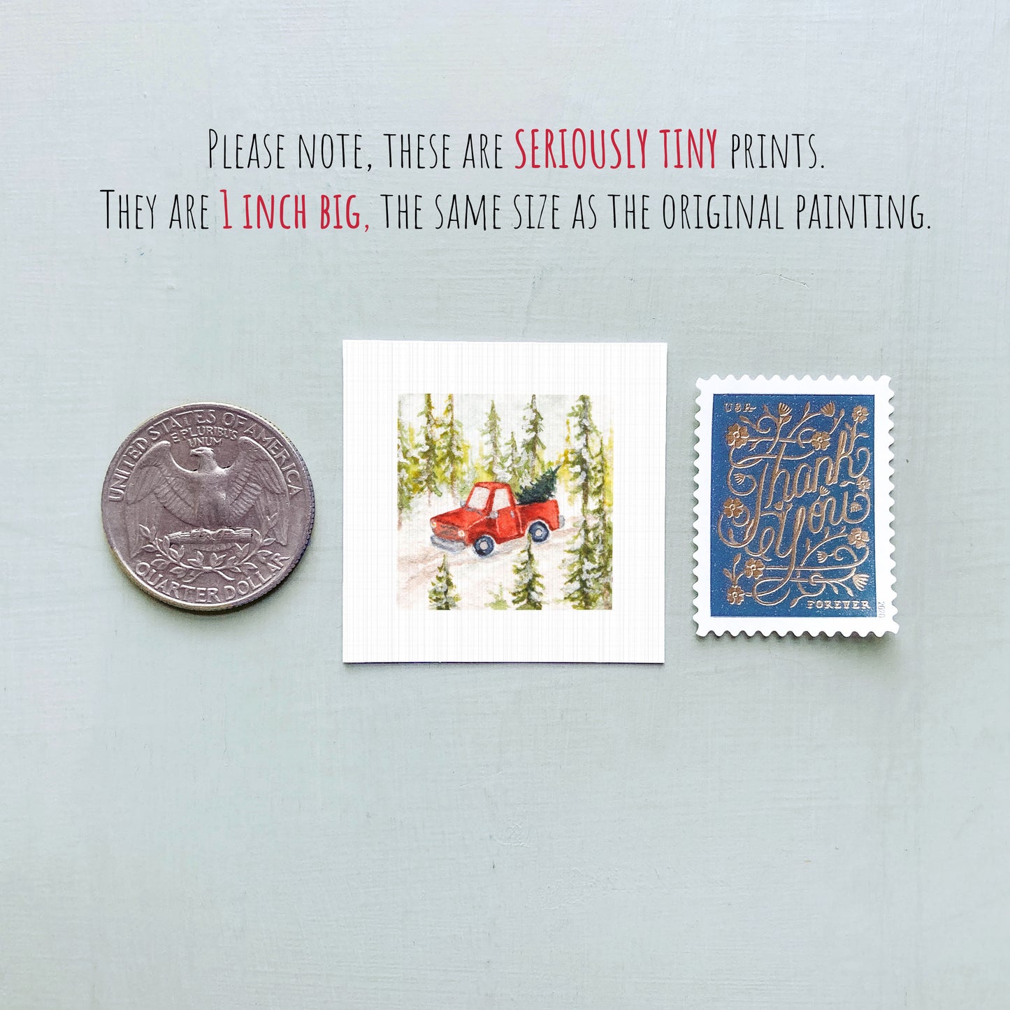 three small prints: a quarter, a postage stamp, and a painting of a red truck.