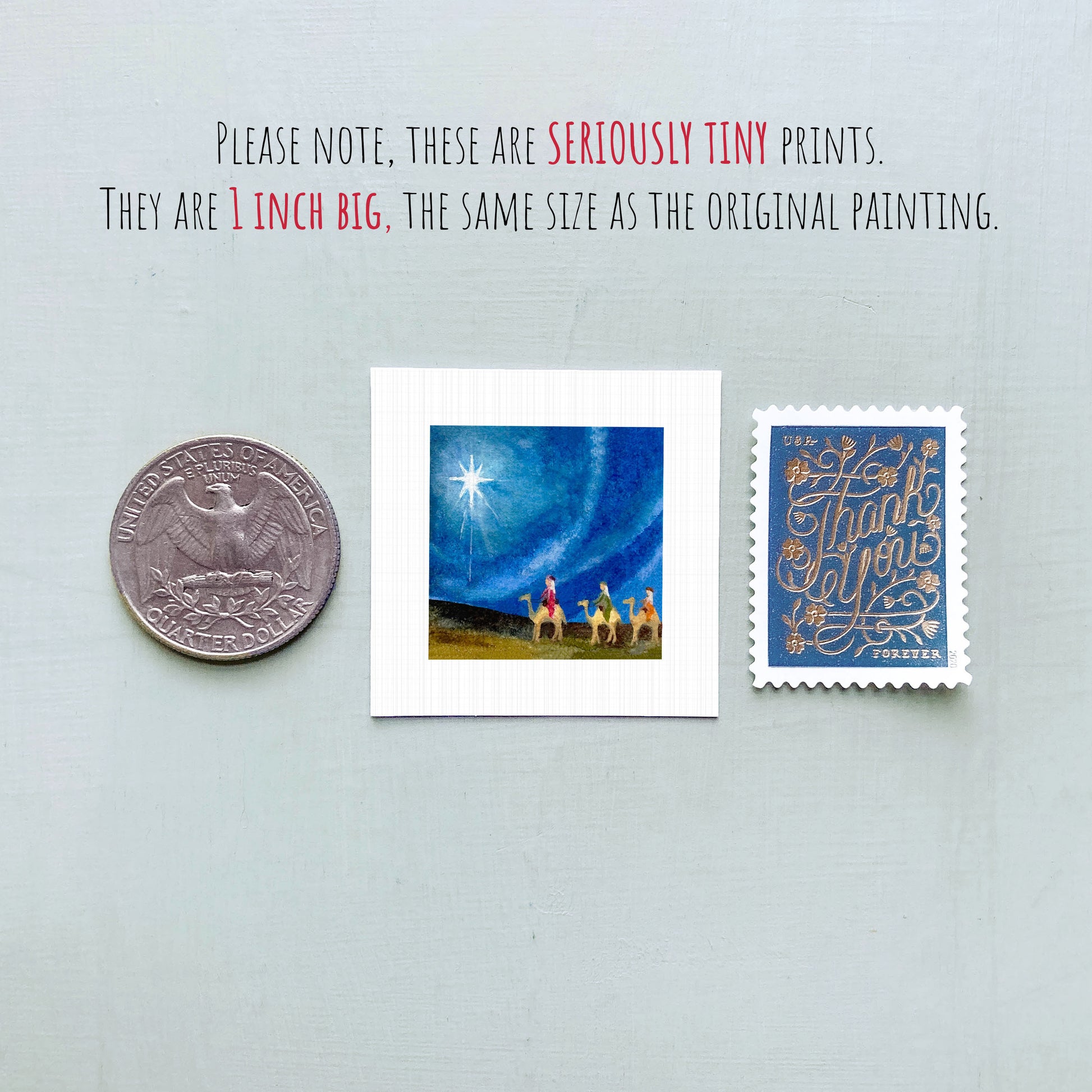three small artworks: a silver coin, a small square print, and a blue postage stamp.