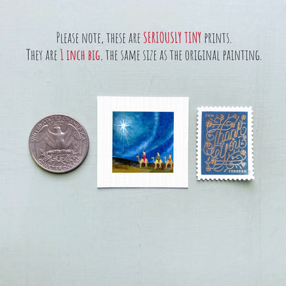 three small artworks: a silver coin, a small square print, and a blue postage stamp.