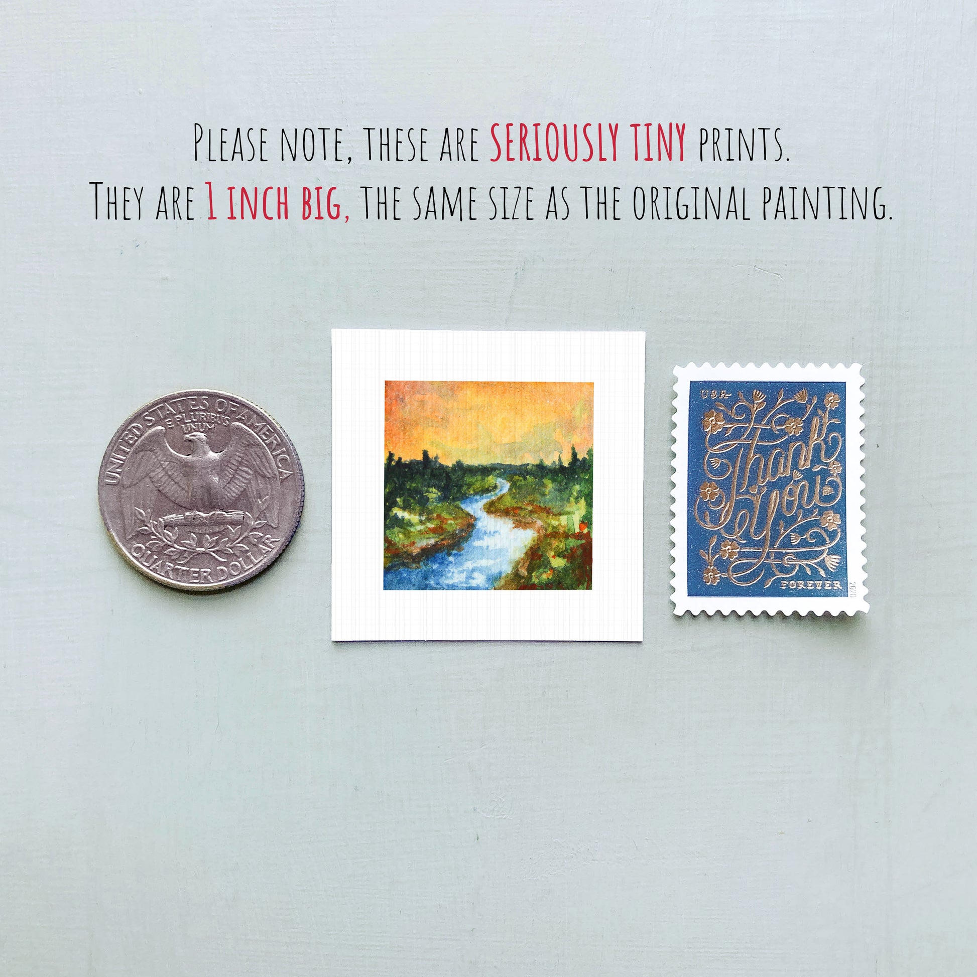 three small artworks or prints, including a coin, a painting of a river, and a postage stamp, all of which are described as "seriously tiny prints" and "the same size as the original painting".