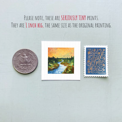 three small artworks or prints, including a coin, a painting of a river, and a postage stamp, all of which are described as "seriously tiny prints" and "the same size as the original painting".