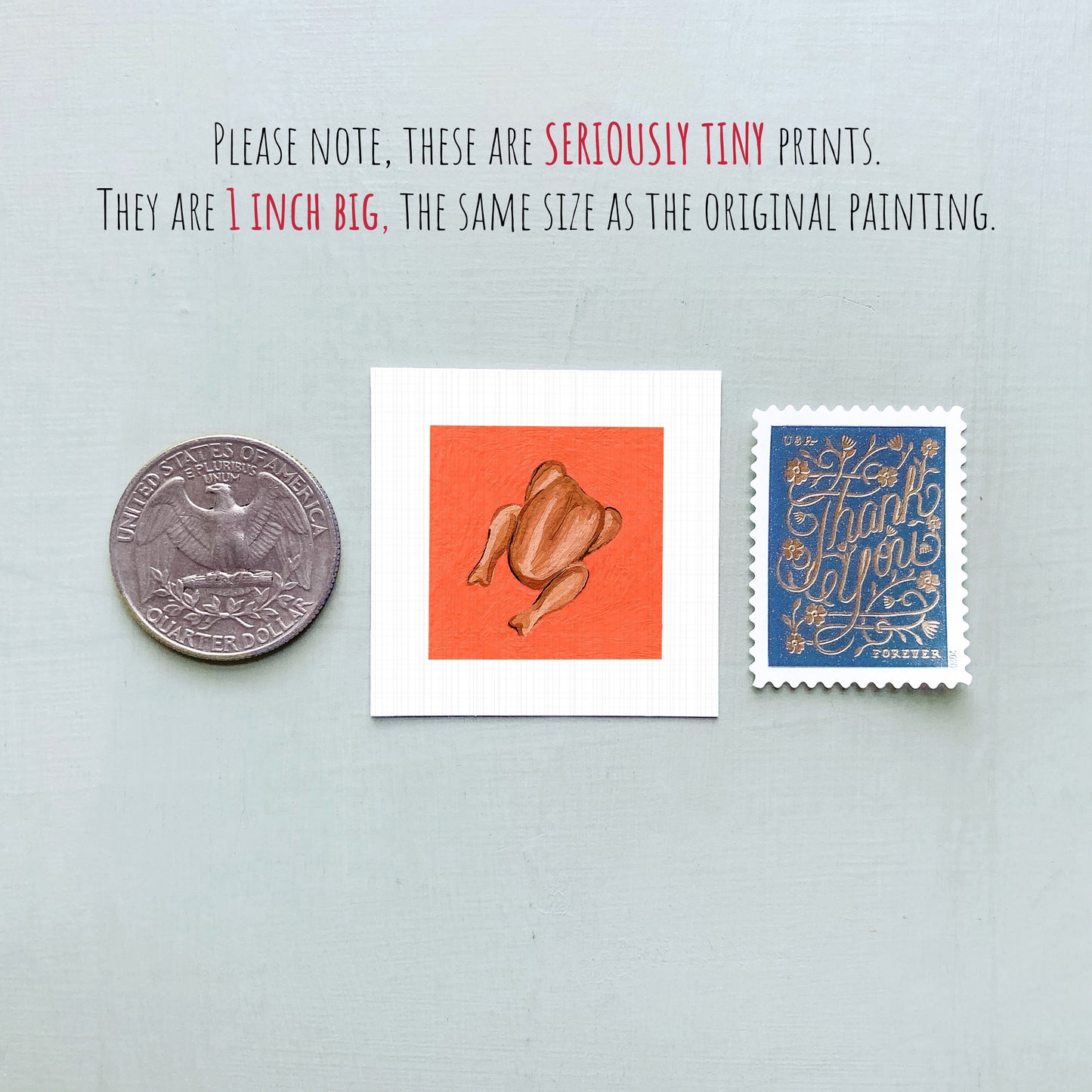 three small, seriously tiny prints: a silver coin, a white square with an orange background depicting a cooked chicken, and a blue postage stamp with gold lettering.