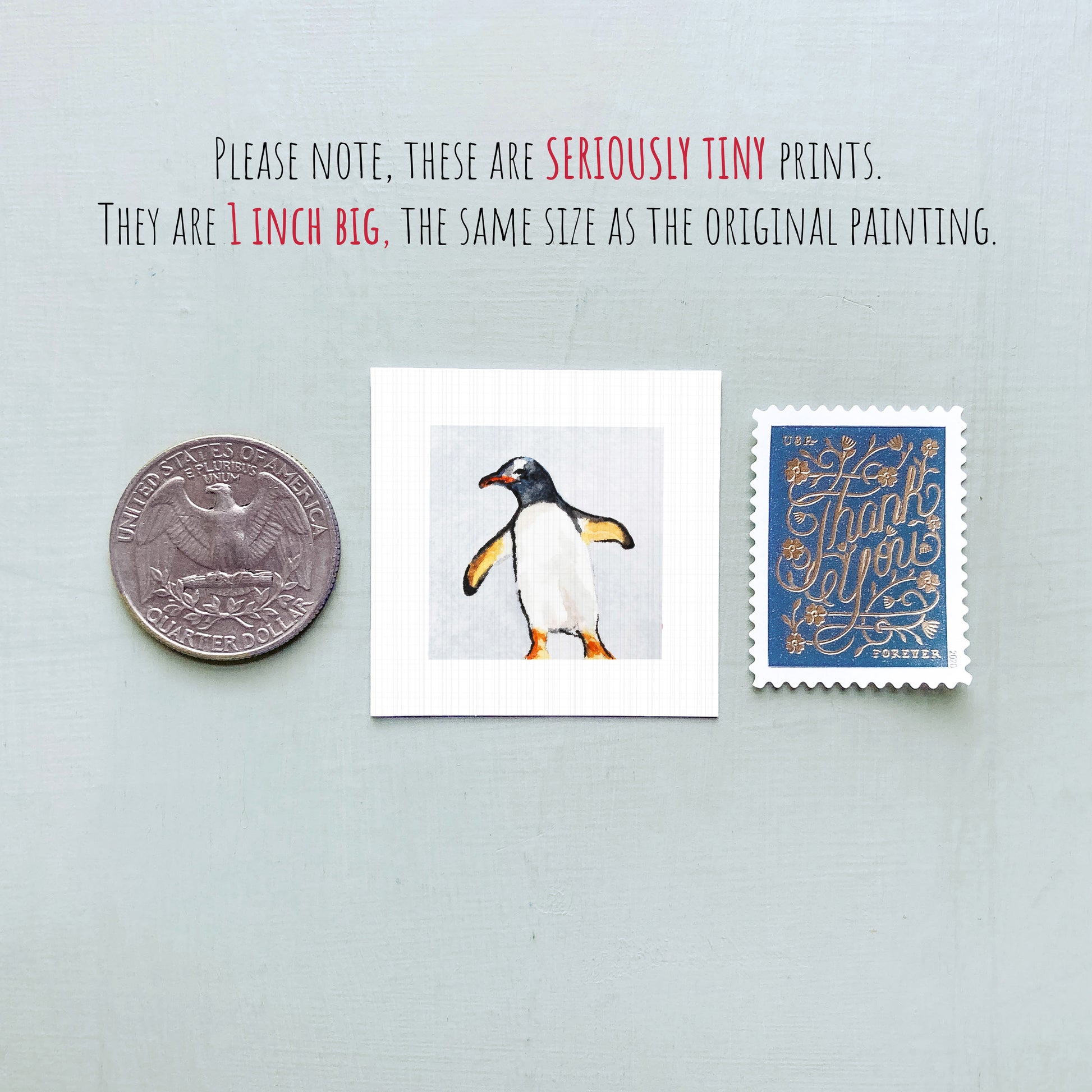 a penguin, a United States quarter, and a postage stamp, all placed next to each other.