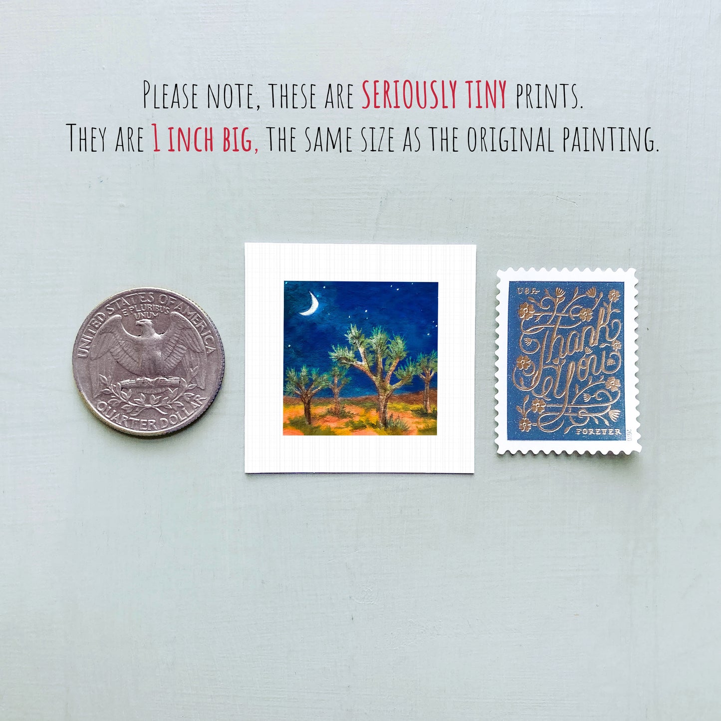 three small artworks: a quarter, a painting of a night sky with a crescent moon, and a postage stamp.