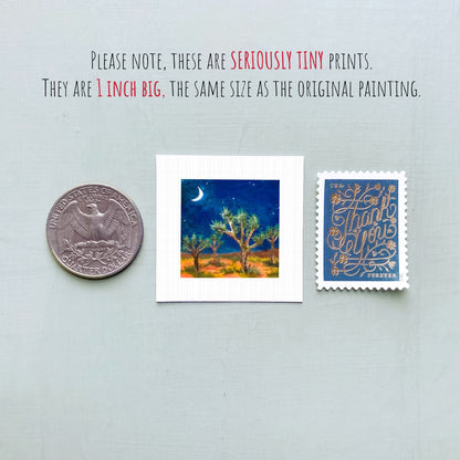 three small artworks: a quarter, a painting of a night sky with a crescent moon, and a postage stamp.